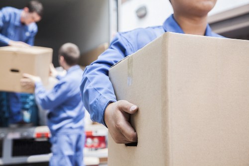 Professional removals in Goddington with moving van and packed boxes